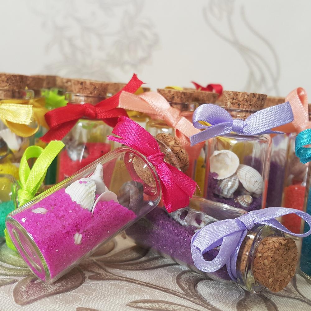 A miniature bottle with colorful sand - Wedding favors and boxes